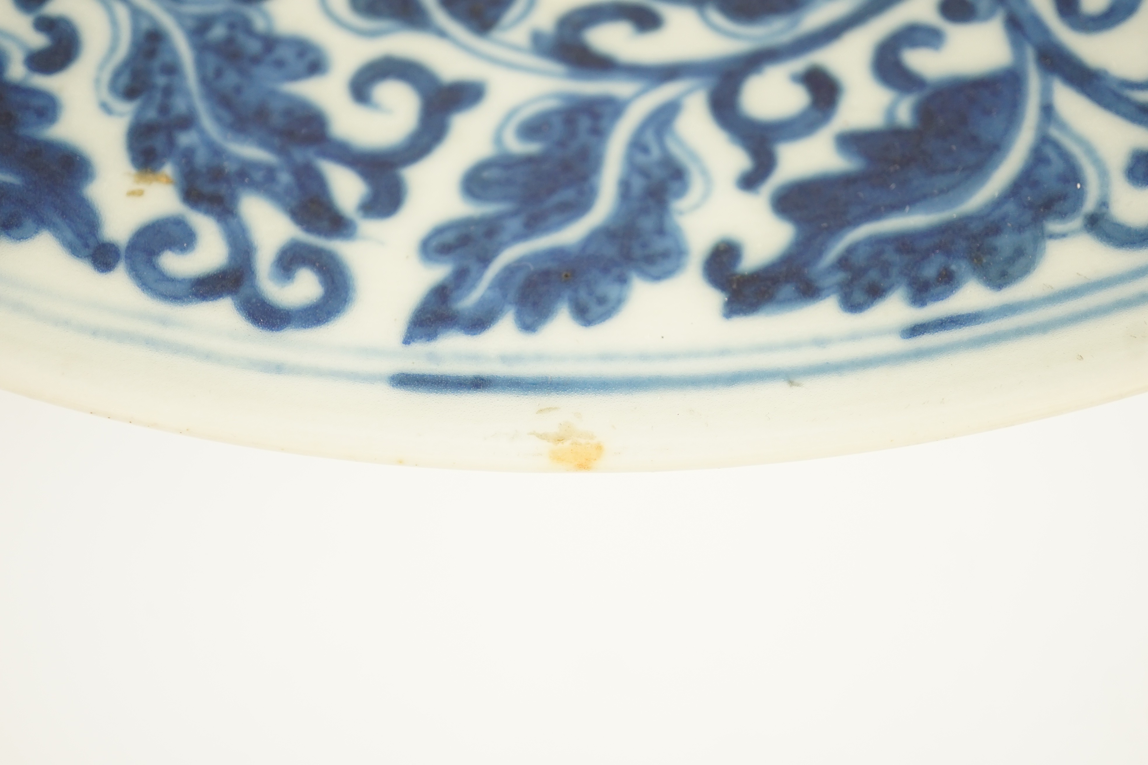 A Chinese blue and white dish, Kangxi mark, 19th century, 34.5cm diameter